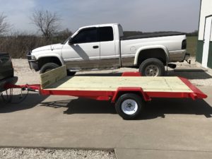 tilting flat bed mini trailer -- ready to tow